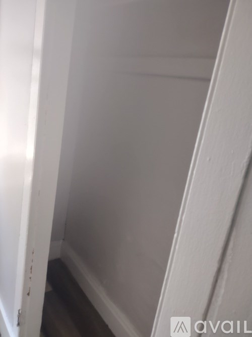A white door with a small hole in the middle.