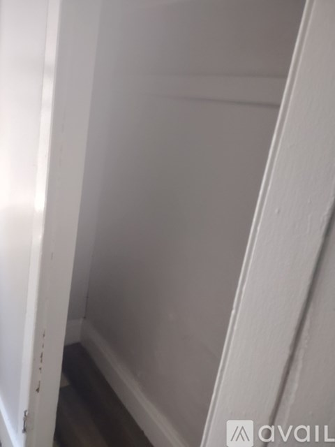 A white door with a small hole in the middle.
