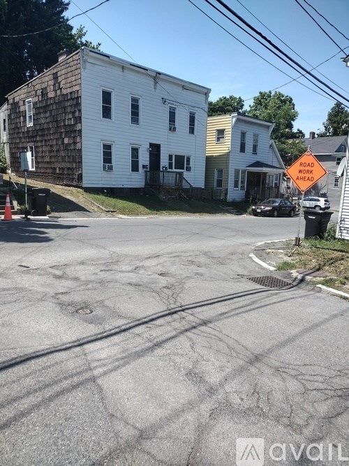 A road work sign is on the right side of the road.