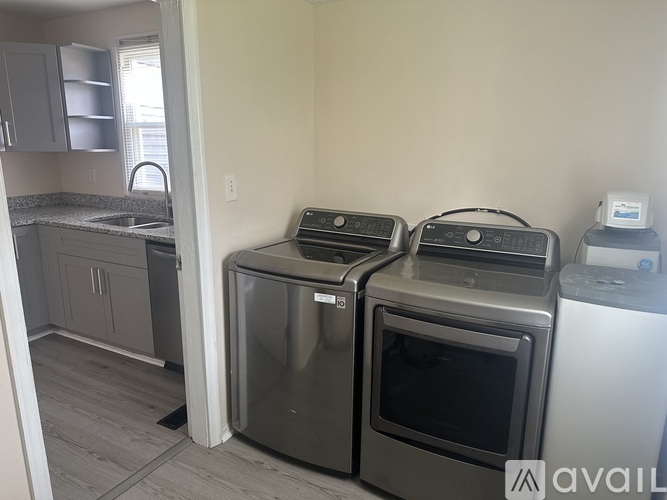 A kitchen with a stainless steel oven and microwave.