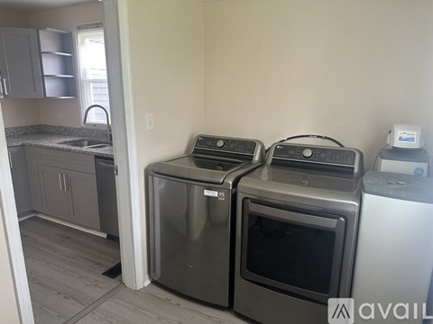 A kitchen with a stainless steel oven and microwave.