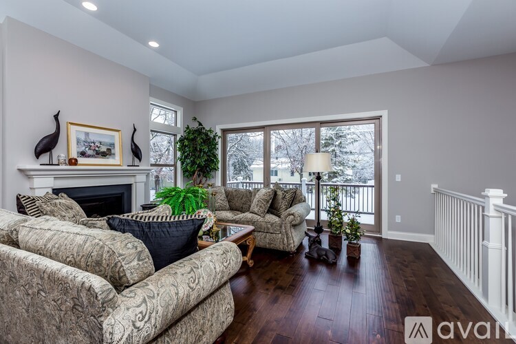 A living room with a fireplace and a couch.