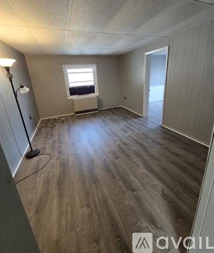 A house with a brown and beige exterior is for sale.