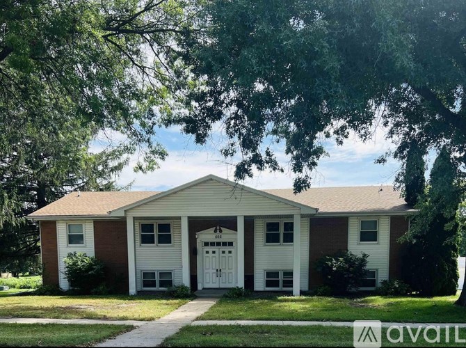 A house with a white garage door is for sale.