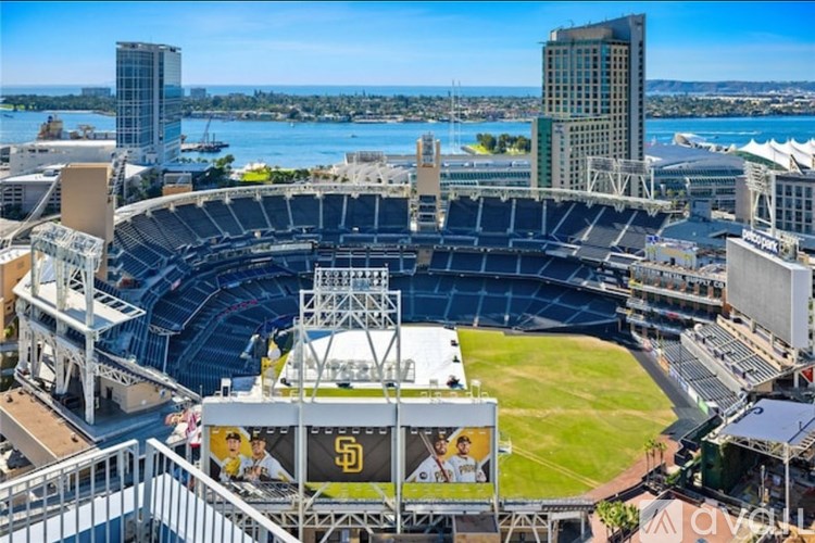 A baseball stadium with a large screen and a logo that reads "SD".