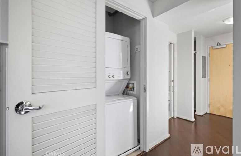 A white door with a silver handle is closed.