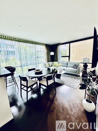 A living room with a black and white color scheme.