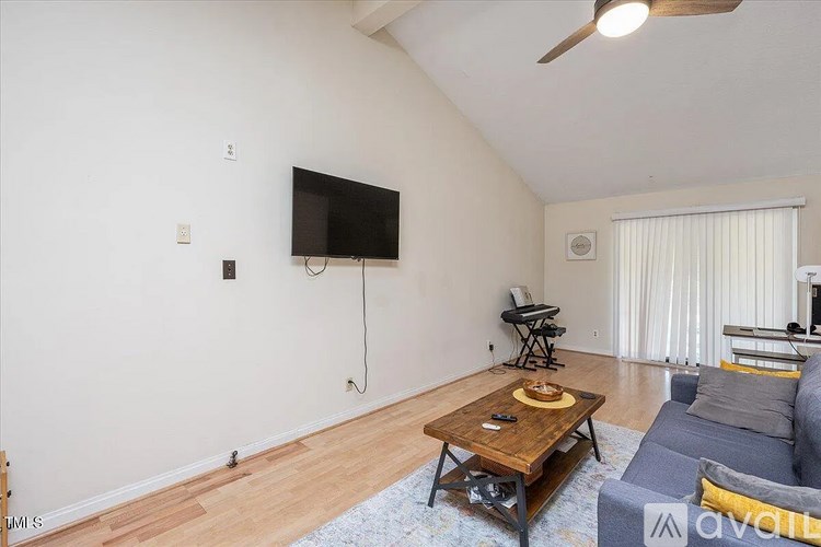 A room with a desk and a computer on it.