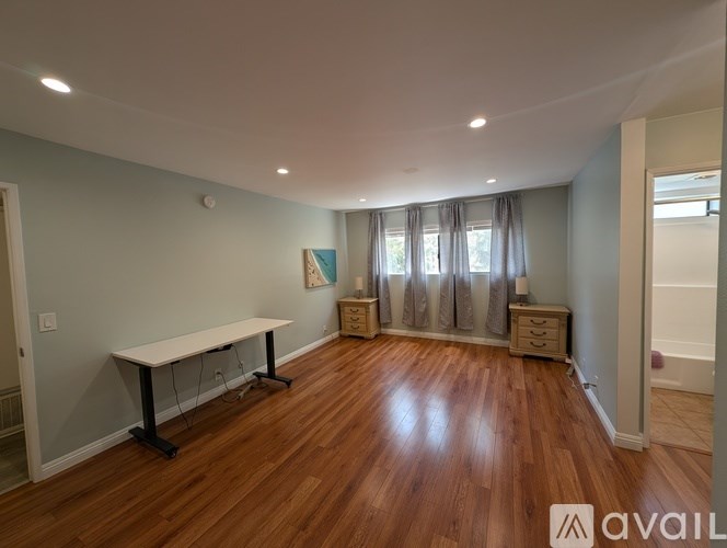 A room with a long table and a cabinet.