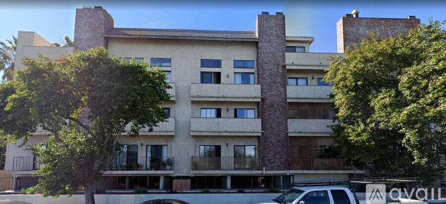 A building with a tree in front of it.