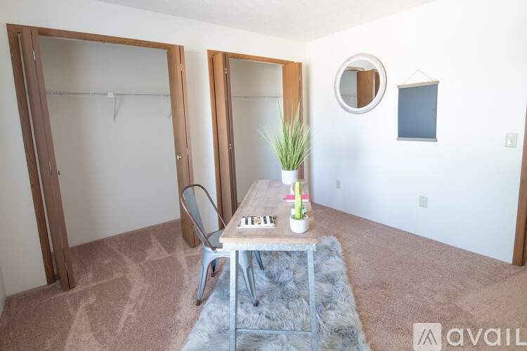 A room with a table and chairs in it.