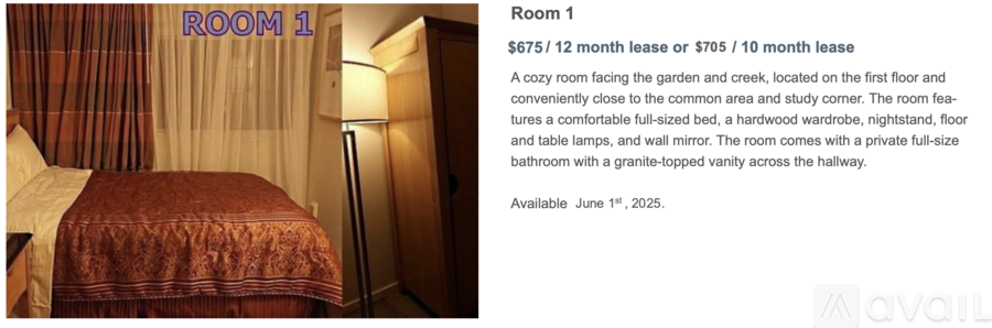 A bedroom with a bed and a window with curtains.