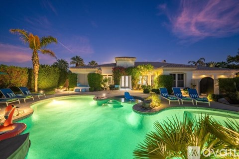 A house with a pool in the backyard.