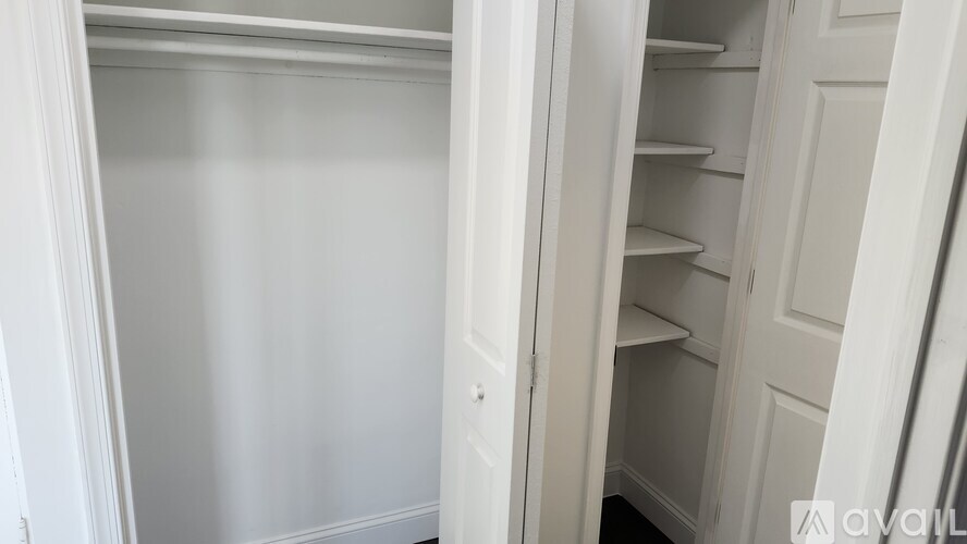 A white empty fridge with the door open.