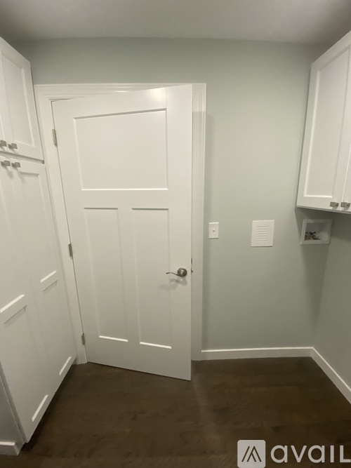 A modern kitchen with a refrigerator, oven, and microwave.