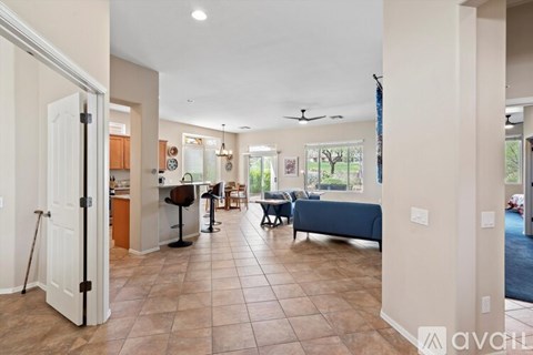 A living room with a couch and a dining table.