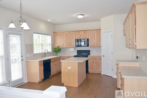 A kitchen with wooden cabinets and a white countertop.