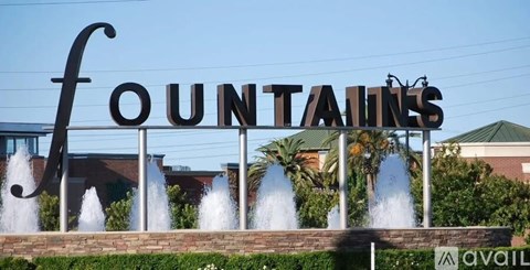 A sign that says Fountains in front of a building.