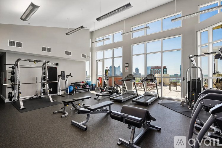 A well-equipped gym with treadmills, weights, and exercise machines.