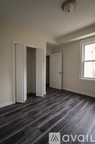 A room with a grey floor and white walls.