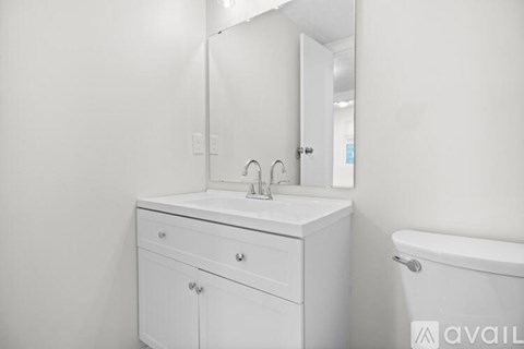 A room with a wooden floor and a light on the ceiling.