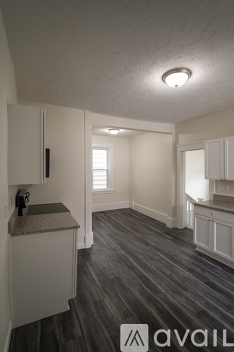 A kitchen with a sink and cabinets.