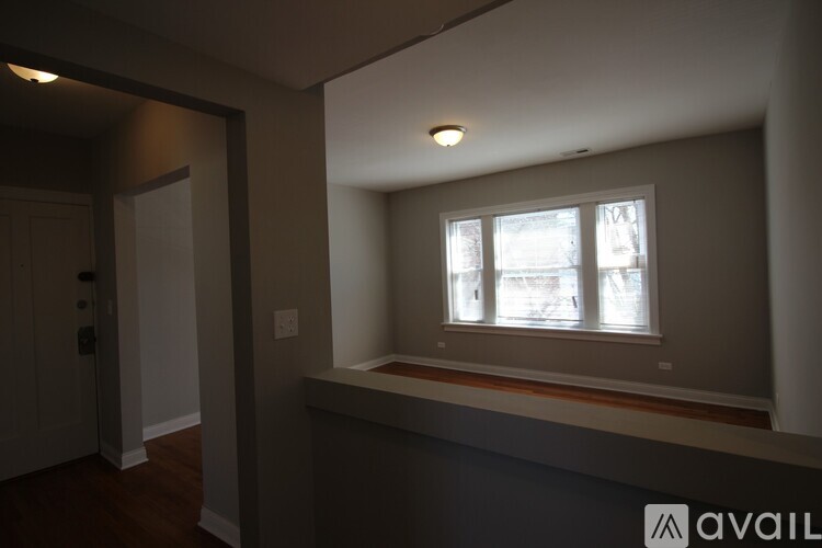 A room with a window and a door.