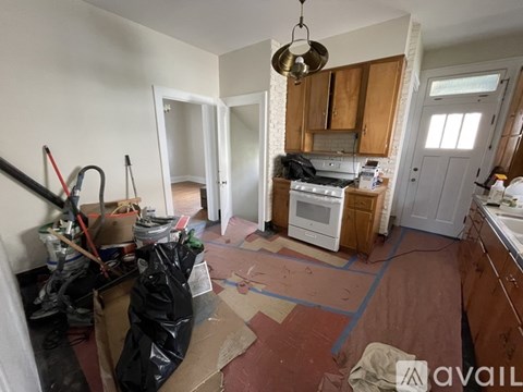 A kitchen with a stove top oven and a microwave.
