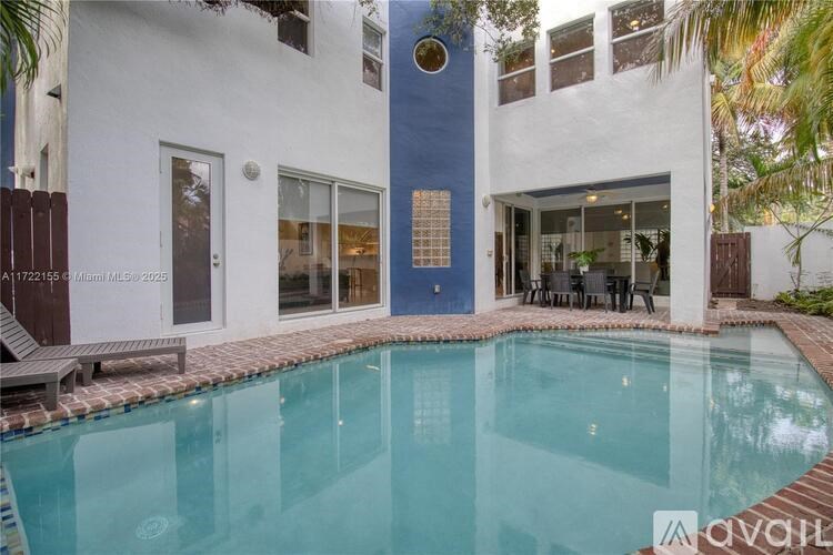 A modern house with a pool in the backyard.