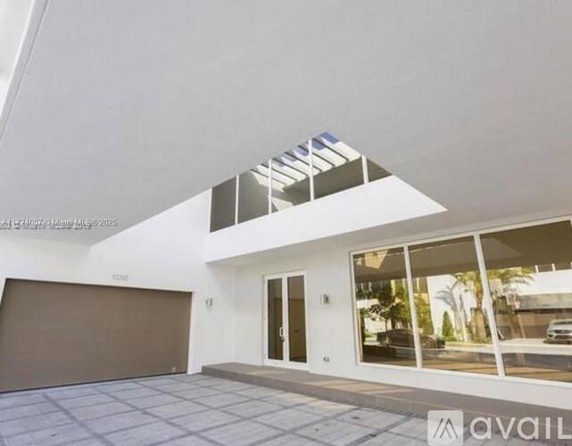 A modern house with a garage and a driveway.