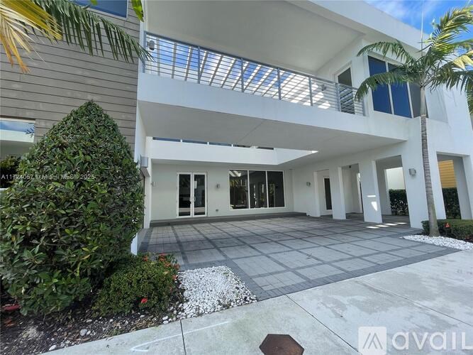A modern house with a large open space and a glass ceiling.