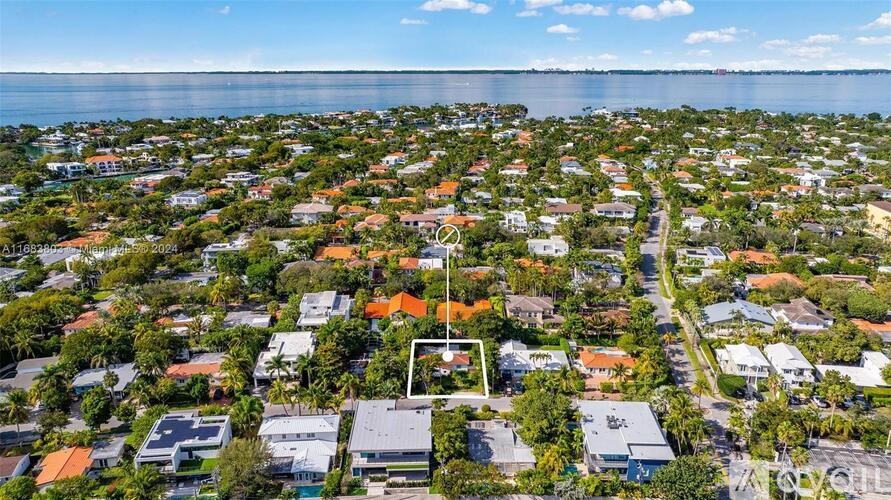 A bird's eye view of a residential area with houses and trees.
