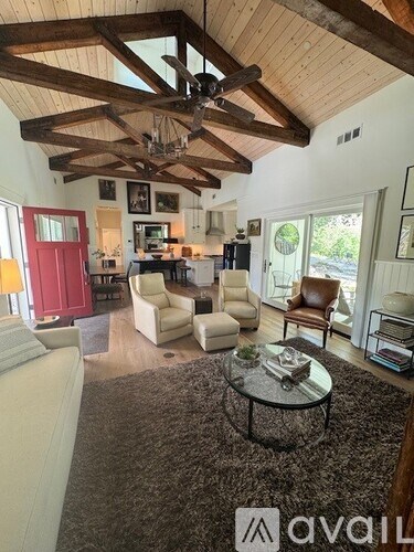 A living room with a white couch and a coffee table.