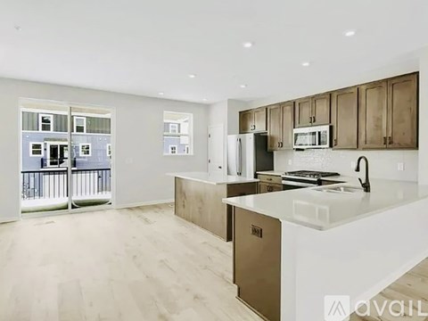 A kitchen with wooden cabinets and a white countertop.