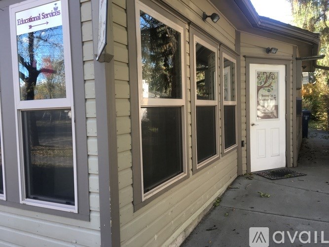 A small building with a sign that says "Environmental Services" on the window.