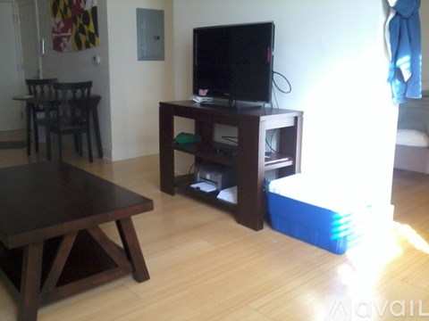 A living room with a television and a coffee table.