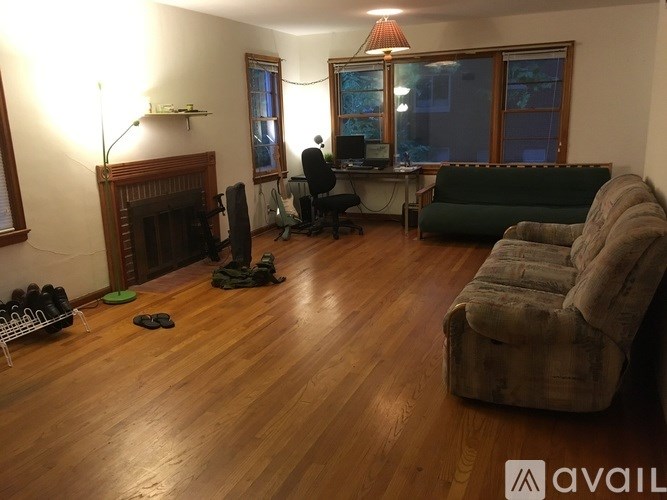 A living room with a fireplace and a couch.