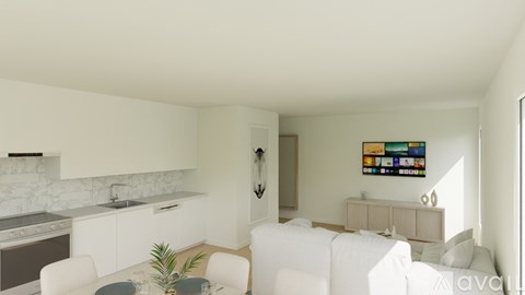 A modern living room with a white sofa and a television on the wall.