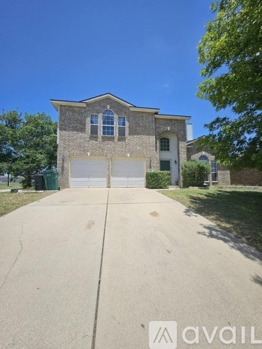 A house with a garage is for sale.