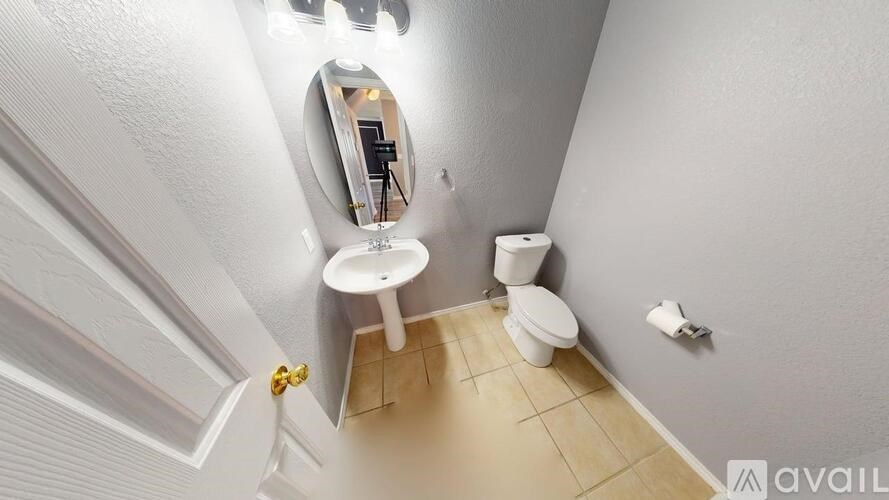 A staircase with a carpeted runner and a white wall on the left side.