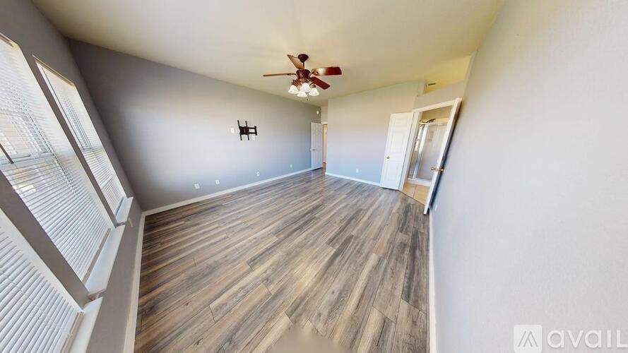 A bathroom with a glass door shower and a toilet.