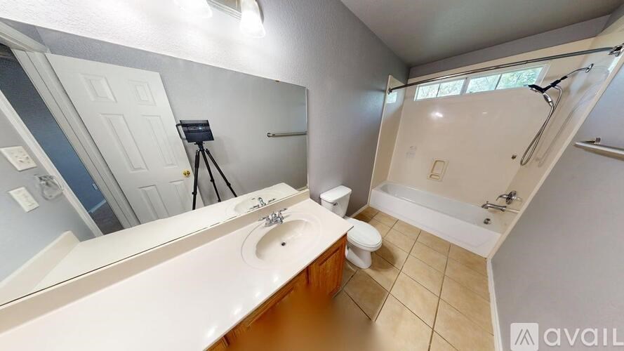 A bathroom with a toilet and a sink.