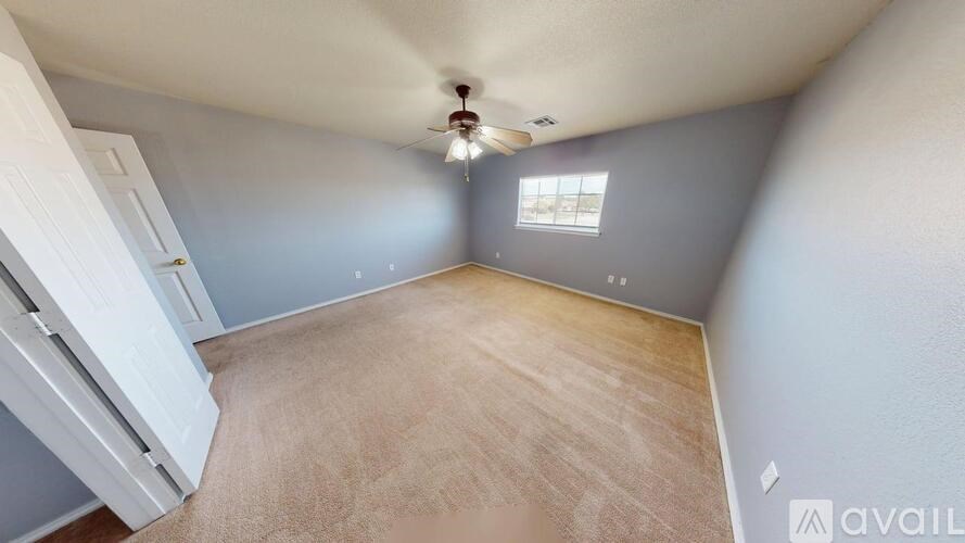 A house with a yard in front of it.