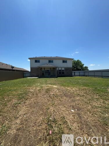 A house with a yard in front of it.