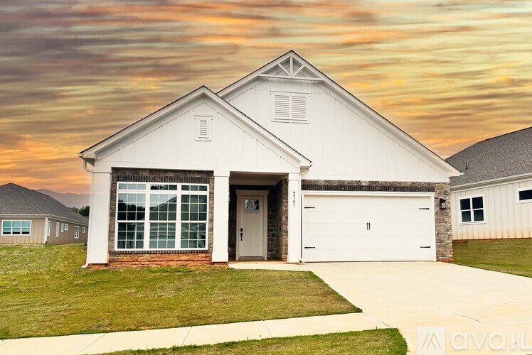 A house with a garage is available for sale.