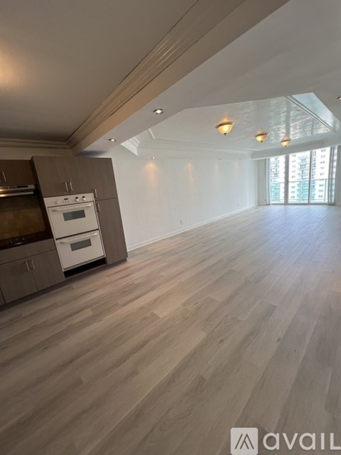 A kitchen with a stove top oven and a dishwasher.