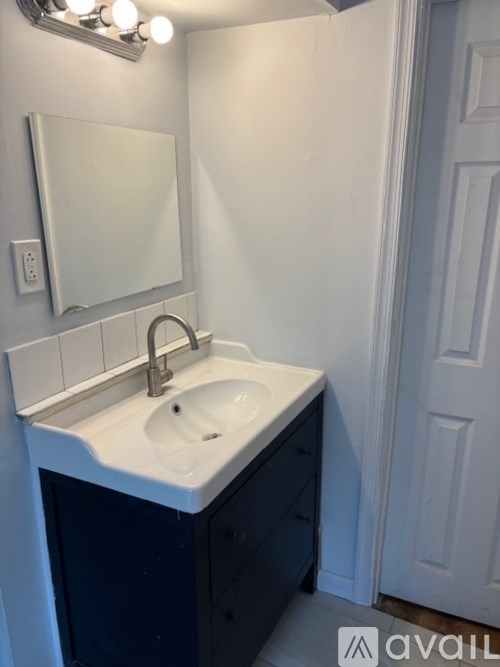 A bathroom sink with a mirror above it.