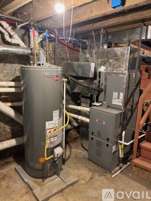 A furnace and air conditioner unit are installed in a basement.