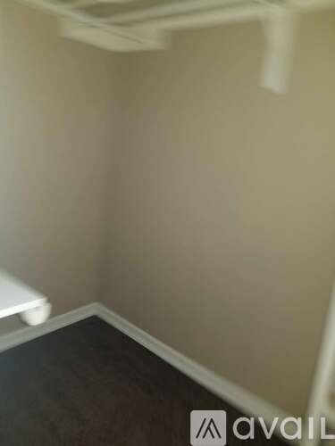 A bathroom with a toilet and a sign that says "avail".