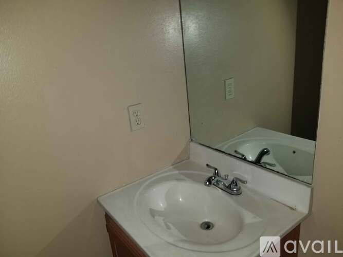 A bathroom sink with a mirror above it.